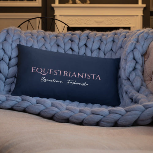 Equestrianista Equestrian Fashionista phrase on navy dec lumbar pillow positioned on sofa.. 