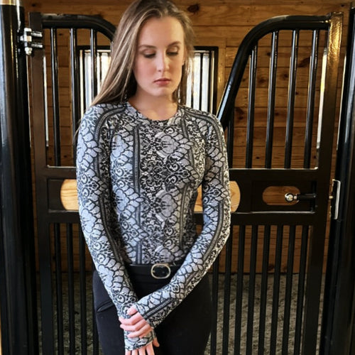 Women's Chantilly Lace Sunshirt modeled in front of stall door.